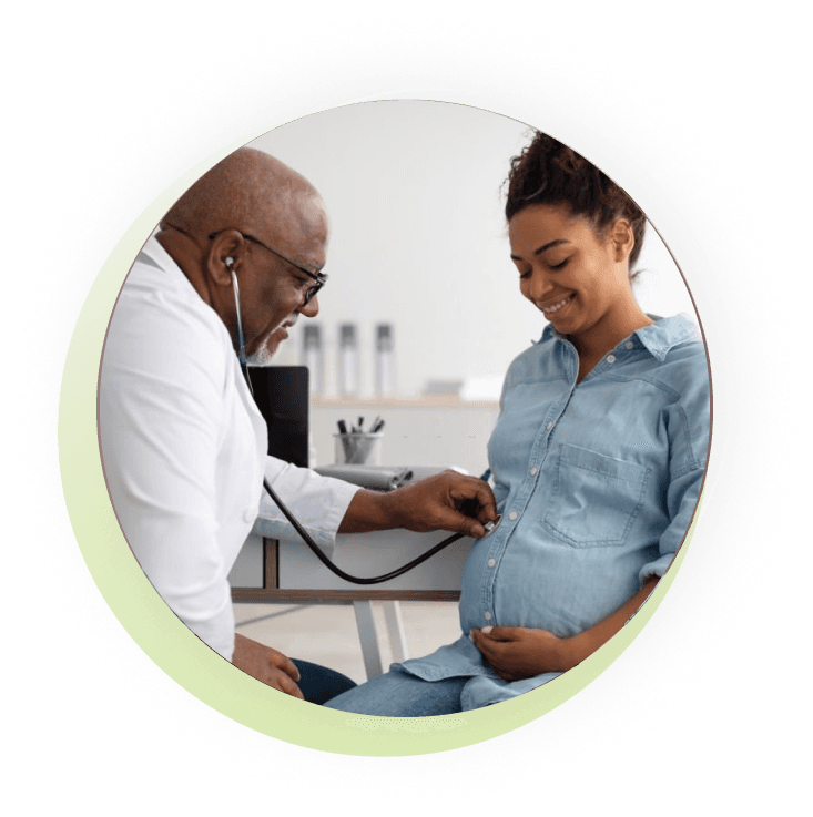 Doctor performing a prenatal check-up for a pregnant woman