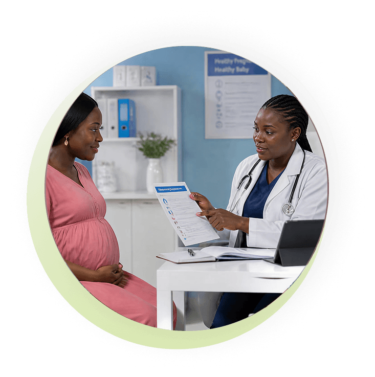 Pregnant woman reviewing a report with her doctor