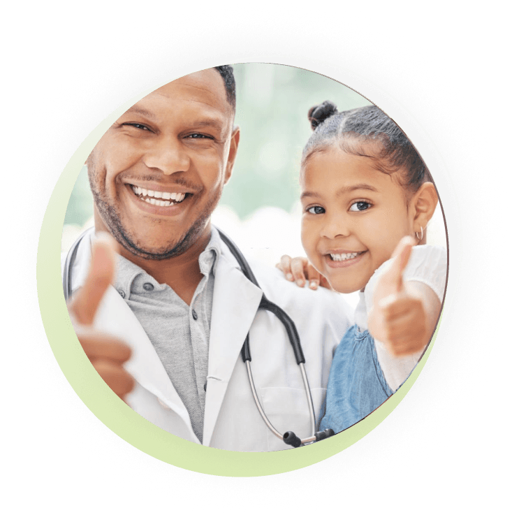 Doctor and young girl giving a thumbs-up