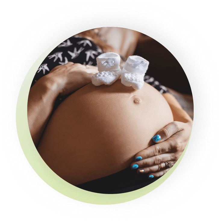 Pregnant belly with baby booties